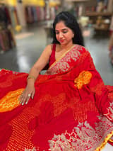 Orangish Red Designer Rai Bandhej Saree With Embroidered Border SS50484