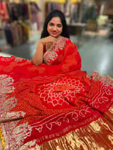 Orangish Red Designer Rai Bandhej Saree With Embroidered Border SS50483