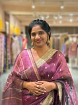 Wine Pure handloom Banarasi Tissue saree hemlined with Sabhyasachi style fringe laces .