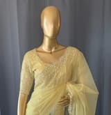 Pastel yellow organza handwork saree