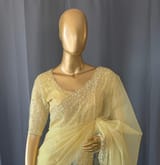 Pastel yellow organza handwork saree