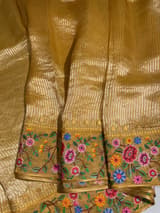 Mango yellow Tissue Stripes Saree with petite point Embroidered tissue border and blouse .