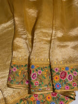 Mango yellow Tissue Stripes Saree with petite point Embroidered tissue border and blouse .