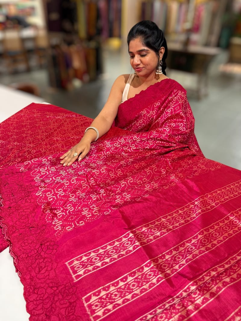 Reddish Pink Cambodian–inspired Ikkat Silk Saree with cutwork Rose Border