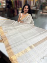 Silver tissue checks Saree with pythani inspired embroidered tissue blouse