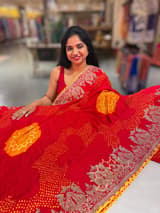 Orangish Red Designer Rai Bandhej Saree With Embroidered Border SS50484