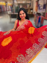Orangish Red Designer Rai Bandhej Saree With Embroidered Border SS50484