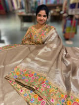Earthy Tone Tissue Stripes Saree with petite point Embroidered tissue border and blouse .