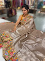Earthy Tone Tissue Stripes Saree with petite point Embroidered tissue border and blouse .