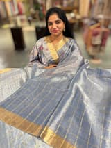 Blue tissue checks Saree with pythani inspired embroidered tissue blouse