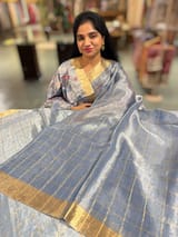 Blue tissue checks Saree with pythani inspired embroidered tissue blouse