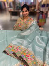 Dusty Blue Tissue Stripes Saree with petite point Embroidered tissue border and blouse .