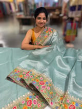 Dusty Blue Tissue Stripes Saree with petite point Embroidered tissue border and blouse .