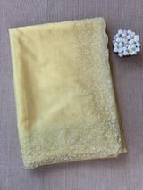 Pastel yellow organza handwork saree
