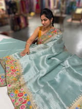 Dusty Blue Tissue Stripes Saree with petite point Embroidered tissue border and blouse .