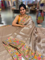 Earthy Tone Tissue Stripes Saree with petite point Embroidered tissue border and blouse .