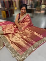 Pink Pure handloom Banarasi Tissue saree hemlined with Sabhyasachi style fringe laces .SS50431