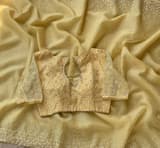 Pastel yellow organza handwork saree