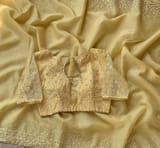 Pastel yellow organza handwork saree