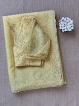 Pastel yellow organza handwork saree