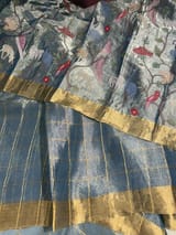 Blue tissue checks Saree with pythani inspired embroidered tissue blouse