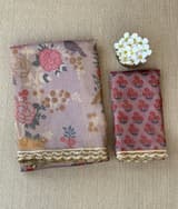 Mauve tissue saree in half and half style with floral and birds