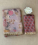 Mauve tissue saree in half and half style with floral and birds