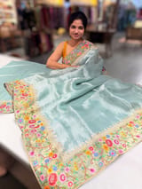 Dusty Blue Tissue Stripes Saree with petite point Embroidered tissue border and blouse .