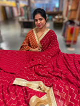 Dark Red Georgette Saree with stick on Badla in zigzag pattern