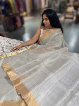 Silver tissue checks Saree with pythani inspired embroidered tissue blouse