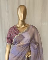 Mauve tissue saree in half and half style with floral and birds