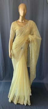 Pastel yellow organza handwork saree