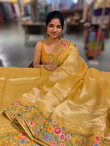 Mango yellow Tissue Stripes Saree with petite point Embroidered tissue border and blouse .
