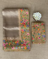 Earthy Tone Tissue Stripes Saree with petite point Embroidered tissue border and blouse .