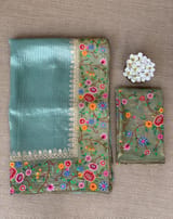 Dusty Blue Tissue Stripes Saree with petite point Embroidered tissue border and blouse .