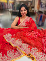 Orangish Red Designer Rai Bandhej Saree With Embroidered Border SS50483