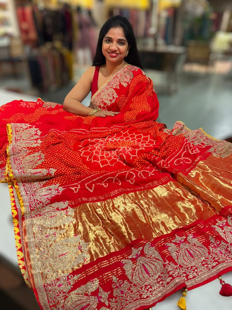 Orangish Red Rai Bandhej Saree with Embroidered Border