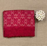 Reddish Pink Cambodian–inspired Ikkat Silk Saree with cutwork Rose Border