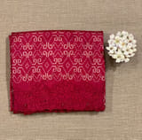 Reddish Pink Cambodian–inspired Ikkat Silk Saree with cutwork Rose Border