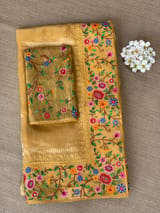 Mango yellow Tissue Stripes Saree with petite point Embroidered tissue border and blouse .