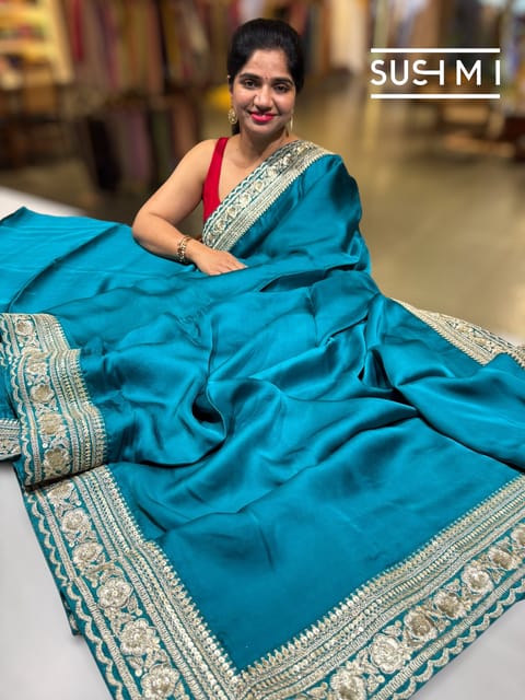 Peacock Blue Satin Saree with Statement Borders