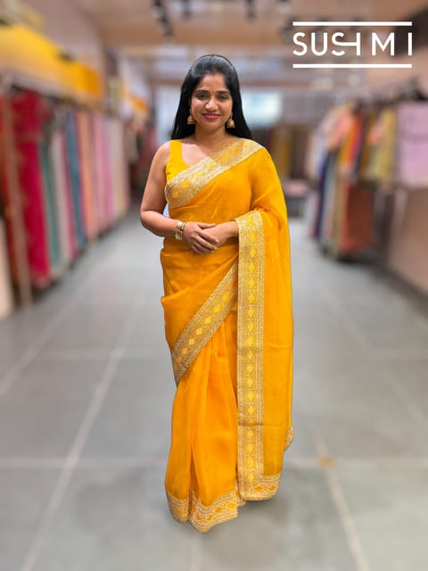 Marigold Yellow Pure Organza Saree with Sabhya Borders