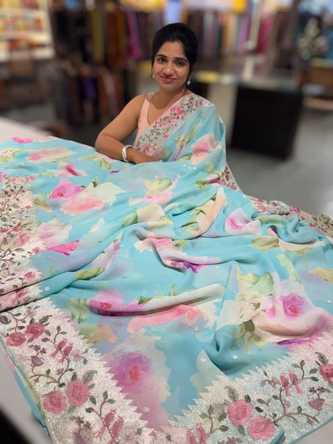 Pastel Blue Printed Georgette Saree with Tissue Embroidered Border