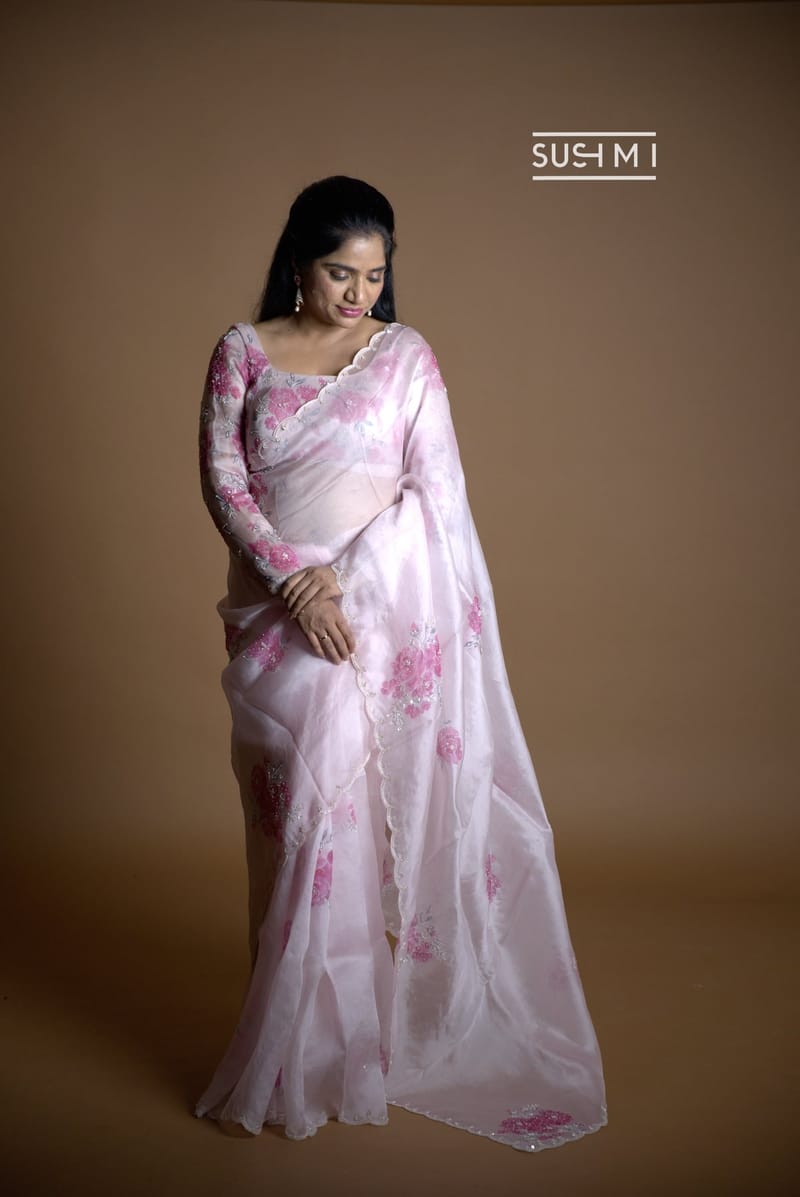 Baby Pink pure organza saree with handpaint and handwork highlighting 