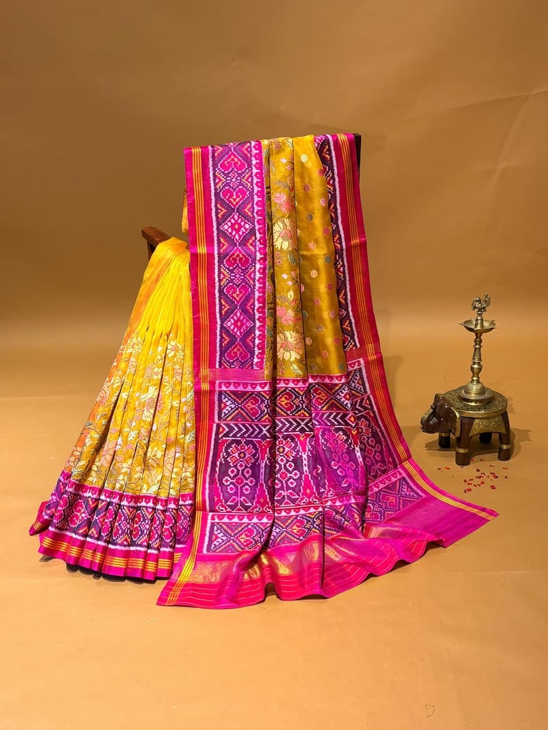 Yellow pure organza and patan patola fusion with jamdani inspired embroidery