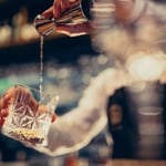 Photo of alcohol being poured into a glass- Straight-Edge Vegan Values