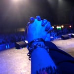 holding hands at music show