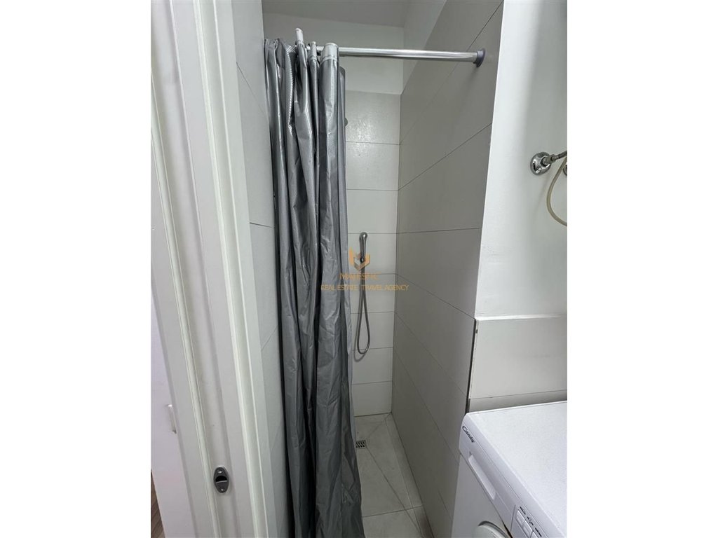 A 1+1 apartment is available for rent behind the American Embassy.