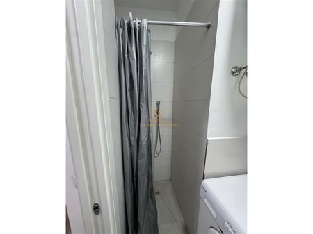 A 1+1 apartment is available for rent behind the American Embassy.