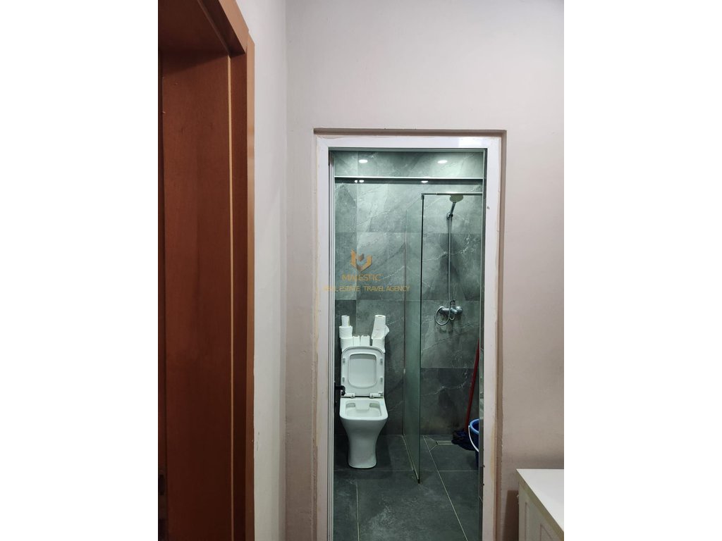 A studio apartment is available for rent near Petro Nini school, opposite the Deshmoret e Lirise high school.